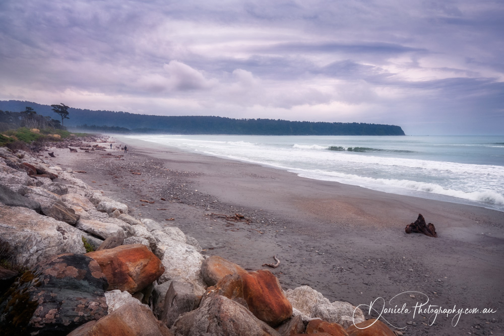New Zealand Surreal foggy and cloudy sunset at Bruce Bay beach